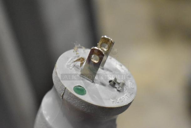 Close-up of hospital-grade electrical plug marked "Hospital Only," part of a Northeast Medical Systems portable hospital bed.