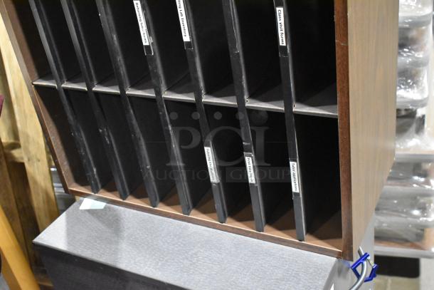 Gray 2-drawer filing cabinet with a wooden 24-cubby mail sorter, labeled for forms and applications, in good condition.