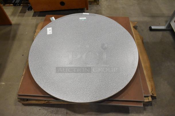 5 assorted tabletops, includes round and square shapes. Lightly used condition with visible tags. Sold as 5 times your bid.