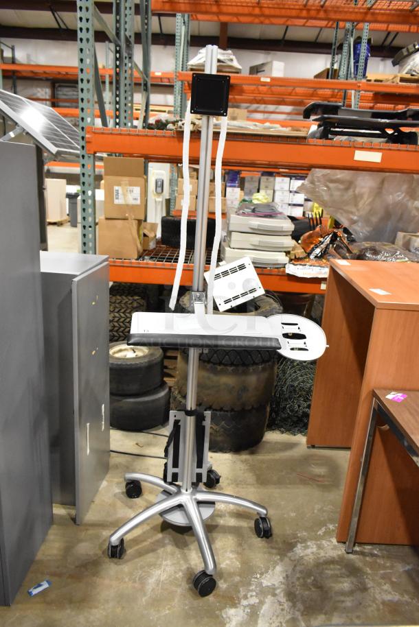 Portable stand with adjustable height and five caster wheels for mobility, integrated control panel, and cable management.