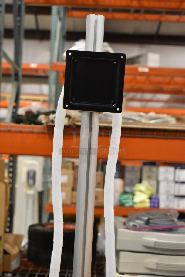 Portable stand on casters with a metal frame, caster wheels, and a mounting plate. Ideal for equipment or monitor support.