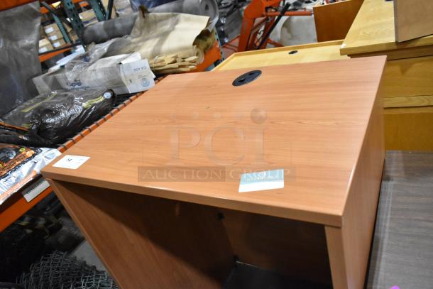 Wood pattern table with cable management hole, good condition; includes podium. Auction: 2 times your bid.