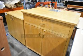 2 wood pattern cabinets; 1 with two doors, 1 with drawer and two doors. Sturdy build, slight wear, silver handles.