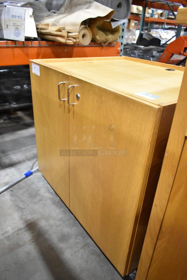 Two wooden pattern cabinets; one with two doors, the other with a drawer and two doors. Excellent condition.