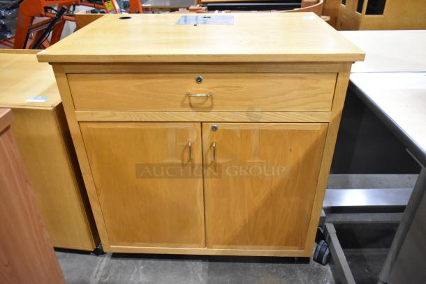 Wood pattern cabinet with one drawer and two doors, metal handles, sturdy condition. Perfect for storage needs.
