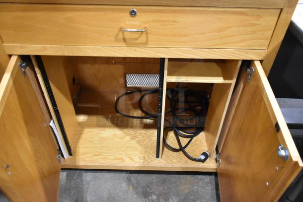 Two wooden pattern cabinets; one with two doors and one with a drawer and two doors. Durable wood, visible cords inside.