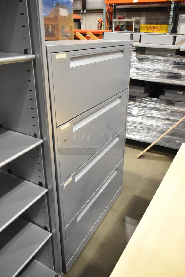 Gray metal 4-drawer filing cabinet and matching bookshelf, in good condition, with keys and labels on drawers.