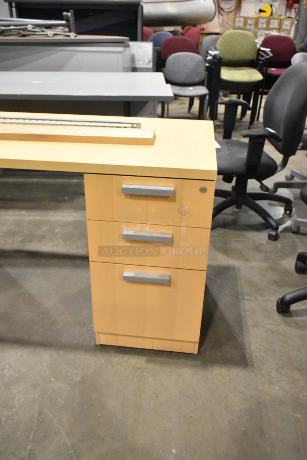 Wood pattern L-shaped desk with 2-drawer and 3-drawer filing cabinets. Features silver handles, good condition.