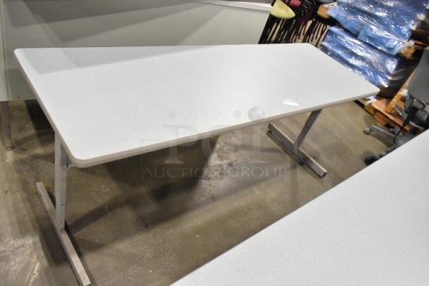 3 gray desks, rectangular, metal legs, minimal wear, smooth surface, office use, auction includes three units.