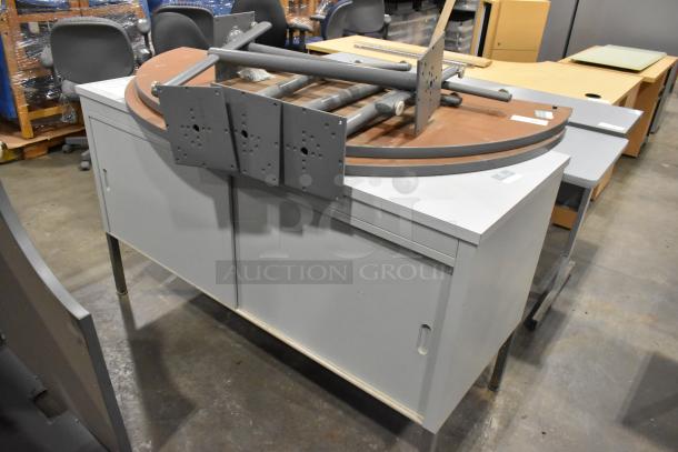 Metal 2-door cabinet with tabletop and legs; used condition. Includes two pieces, ideal for storage or workspace.