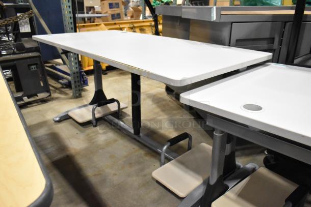 Four versatile desks/tables with white tops and sturdy metal legs. Includes cable management grommets. Good condition.