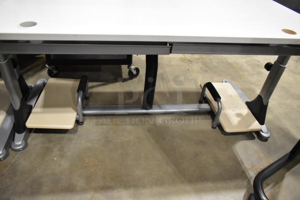 Set of 4 versatile desks/tables, metal frame, beige footrests, excellent condition, enhances workspace functionality.