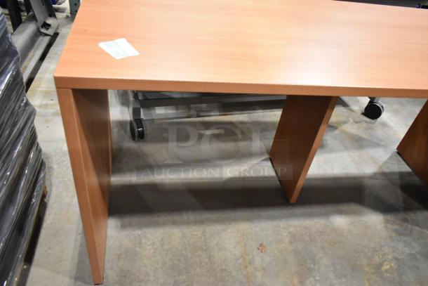 Wood pattern desk, rectangular, wood veneer finish, excellent condition, sturdy construction, visible label on top corner.
