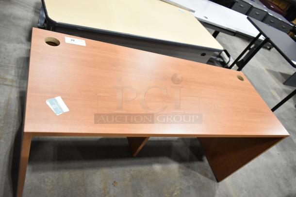 Wood pattern desk with two cable management holes, rectangular shape, excellent condition, slight wear. Auction tag "28".