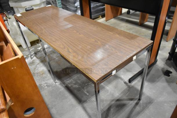 Two wood pattern items, including a desk and table, featuring chrome legs. Good condition. Labels indicate auction details.