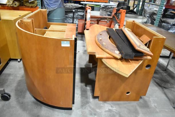 Wood pattern desk set up with curved panels and assorted components. Visible wear. Label reads "Overnight Office." Suitable for reassembly.