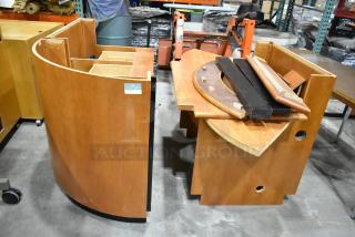 Wood pattern desk set up with curved panels and assorted components. Visible wear. Label reads "Overnight Office." Suitable for reassembly.