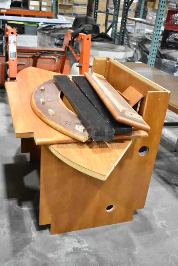 Wood pattern desk setup with multiple pieces, curved design, natural finish, minor wear visible; ideal for office use.