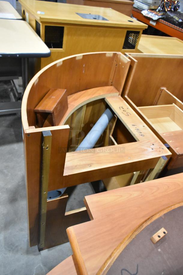 Wood pattern desk set, featuring curved design and light wood finish; visible writing on surface, good condition.