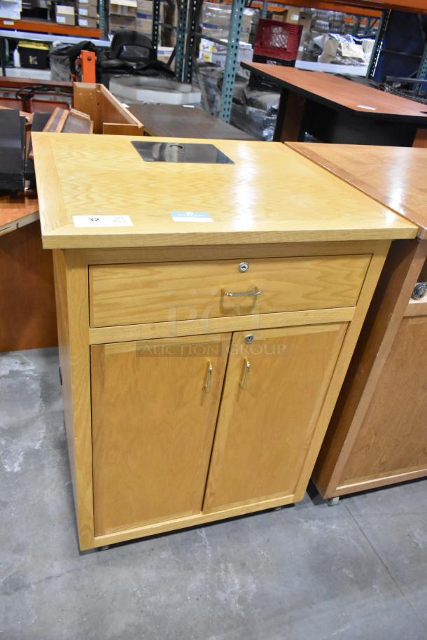 Wood pattern counter with two doors, one drawer missing, metal handles. Includes a square cutout on top. Good condition.