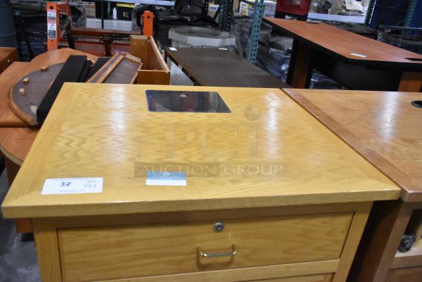 Wood pattern counter with drawer and two doors; missing one drawer. Good condition. Auction tags visible.