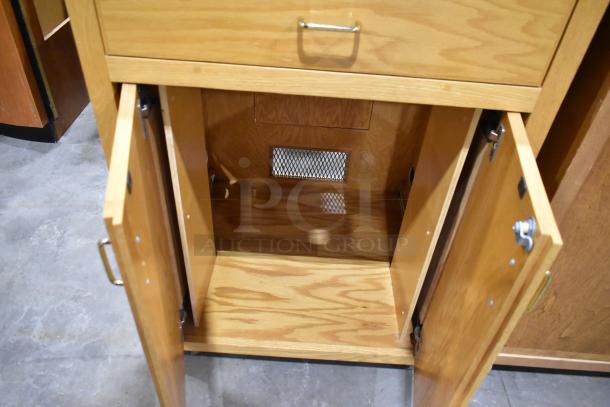 Wood pattern counter with one drawer and two doors, missing one drawer. Handles intact. Auction item, bid doubles.
