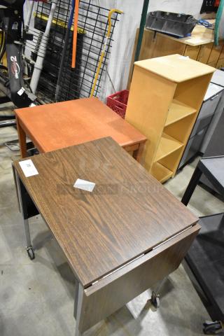 Three wood-pattern furniture pieces: a desk on casters, a square table, and a three-shelf bookcase. Each has a distinct wood finish.
