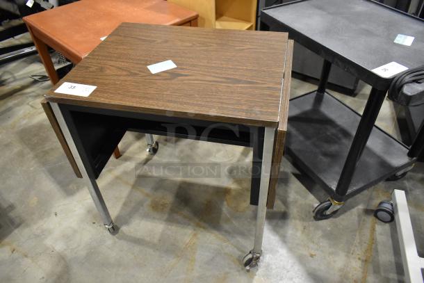 3-piece set: wood-pattern desk on casters, table, and bookshelf. Desk labeled "35". Ideal for office use.