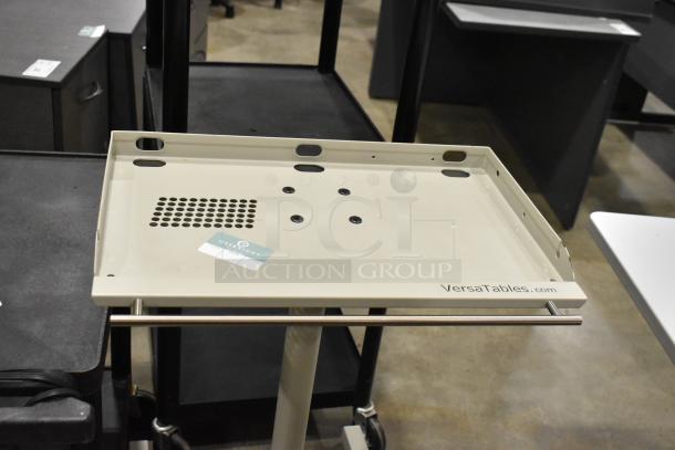 3 carts on casters, including 2 AV carts by VersaTables. Features include a perforated section and a "OVERNIGHT" label.