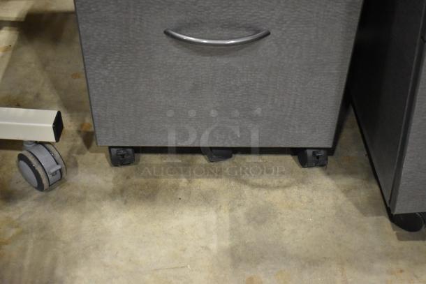 4 gray two-drawer filing cabinets on casters, metal handles, textured finish, good condition, auction lot.