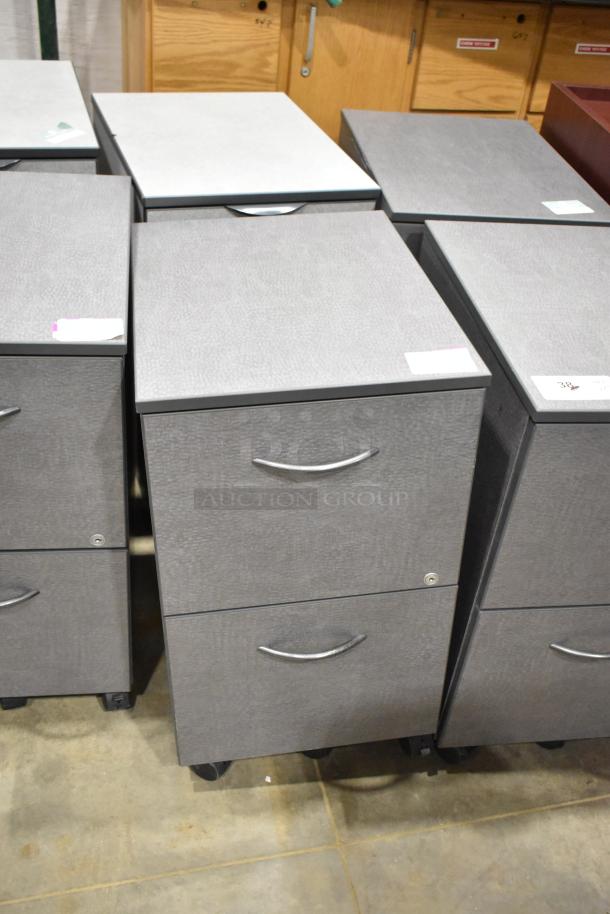 Gray 2-drawer filing cabinets on casters, set of 4, with curved handles, in good condition, tags visible on top.