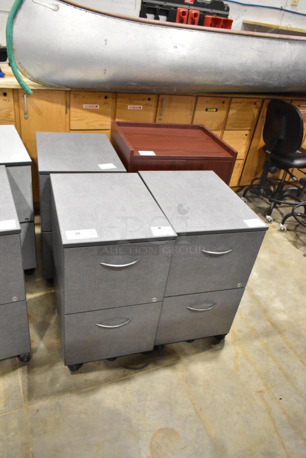 4 gray two-drawer filing cabinets on casters and one wood-pattern two-door cabinet, auction lot of four.