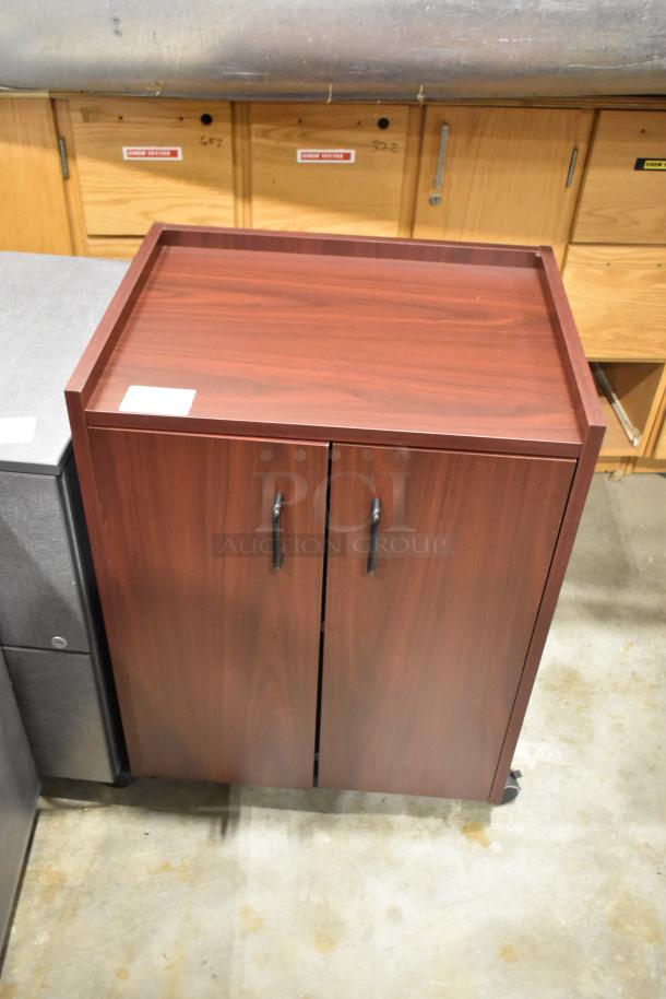 4 items: 3 gray 2-drawer filing cabinets on casters, 1 wood pattern 2-door cabinet. Good condition.