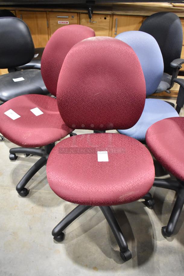 Various office chairs on casters, mixed colors, moderate wear, fabric upholstery. Includes multiple units in auction lot.