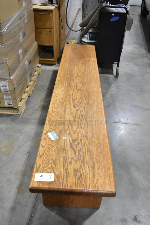 Wood pattern bench with grain detailing. Rectangular shape, sturdy build. Auction tag number 41 visible. Good condition.