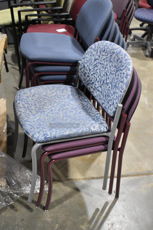 28 assorted stackable chairs, various colors and patterns, metal frames, appear gently used. Includes blue and patterned designs.