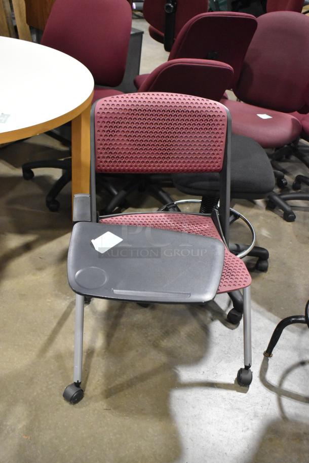 12 assorted chairs, some with casters; burgundy, black seat and rounded backrest; mixed conditions; auction item.