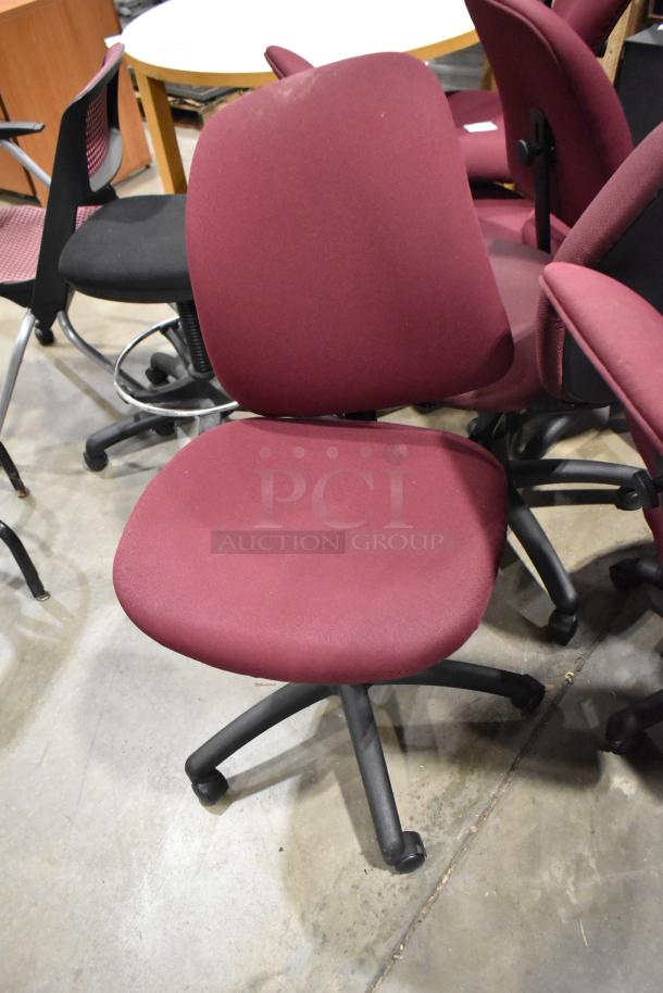 12 assorted office chairs in various conditions, including some with casters, burgundy and black fabric seats and backs.