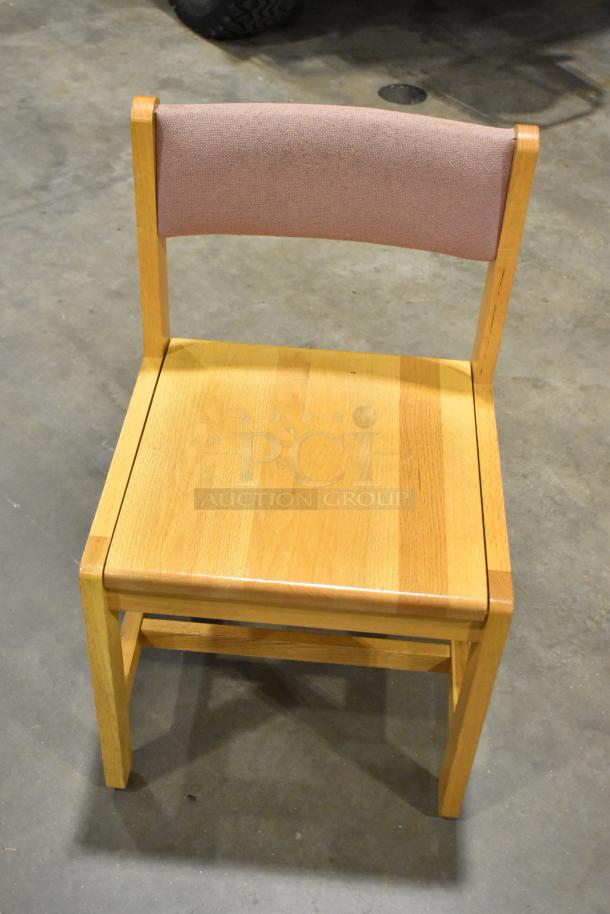 Wood pattern chair with wooden frame and cushioned backrest. Good condition. Auction for 8 chairs, bid multiplies by 8.