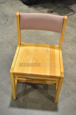 Wood pattern chair with wooden frame and cushioned backrest. Good condition. Auction for 8 chairs, bid multiplies by 8.