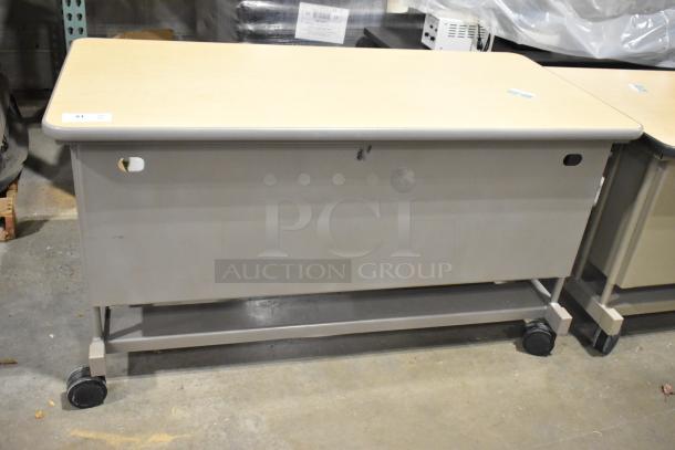 2 wood pattern desks on casters, beige and gray, with minor wear, movable for flexible use, lot includes two desks.