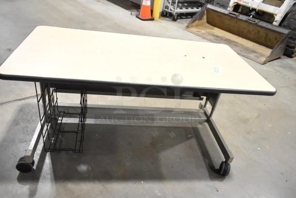 Two wood pattern desks on casters, featuring metal frames and wire shelving, in used condition. Perfect for office use.