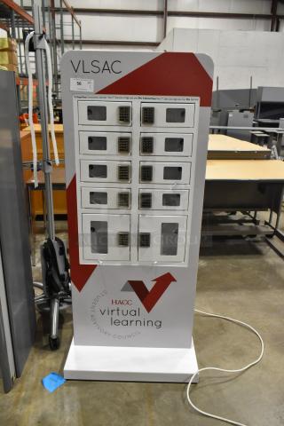 Metal 10 cubby filing cabinet with combination lock for each cubby, in good condition, marked "HACC Virtual Learning".