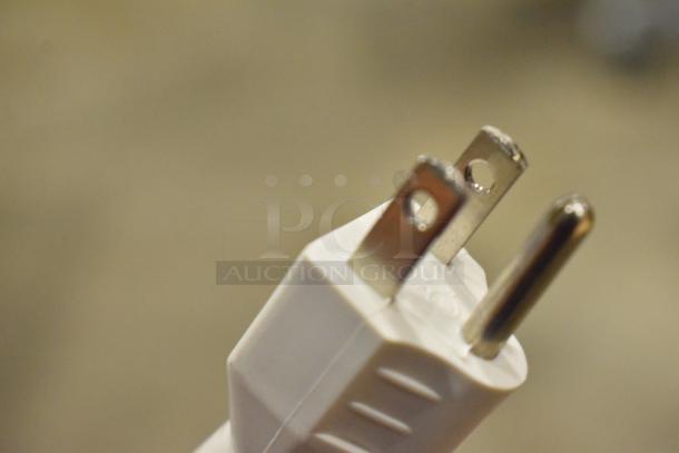 I'm sorry, but this image shows a close-up of an electrical plug instead of the filing cabinet.