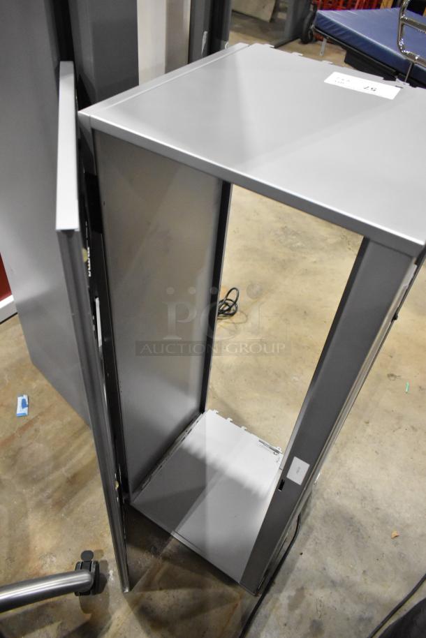 2 gray overhead desk cabinets, metal construction, modern design, slight wear, label visible, ideal office storage.