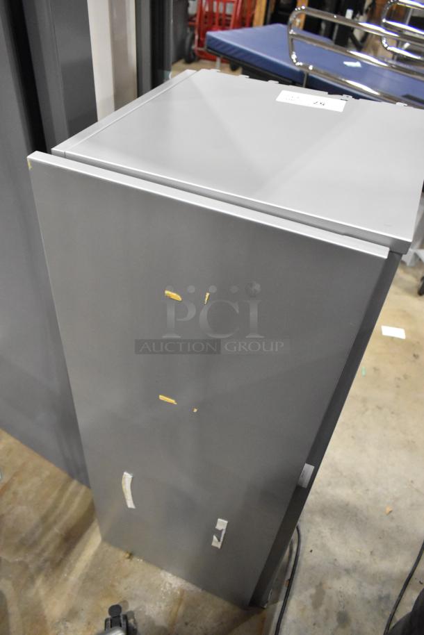 Gray overhead cabinet for desks, minor scratches, and adhesive marks. Auction includes two units.