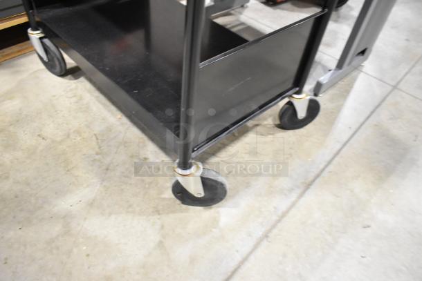 Black 3-tier cart on casters, excellent condition, sturdy metal frame, ideal for storage and mobility.