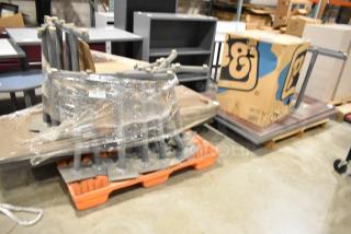 Two pallets containing assorted tabletops and table legs, shrink-wrapped for auction, with a large cardboard box labeled "EJ" included.