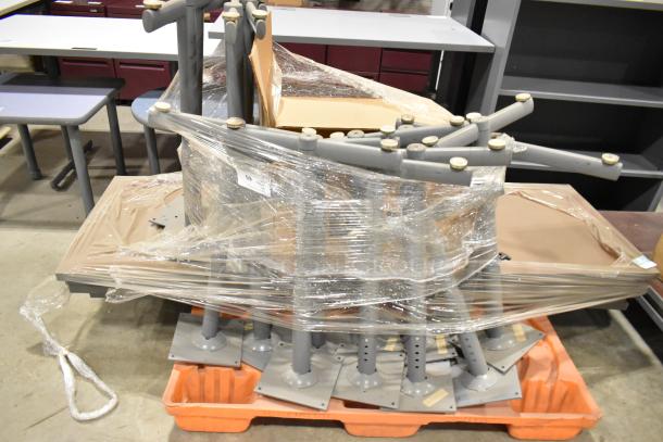 Two pallets with tabletops and table legs, wrapped in plastic. Includes labels indicating bid multiplier.