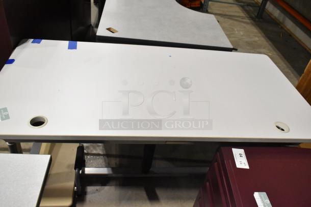 Three gray desks, slightly used, rectangular and L-shaped, with cable grommets. Ideal for office setups; bid includes all.